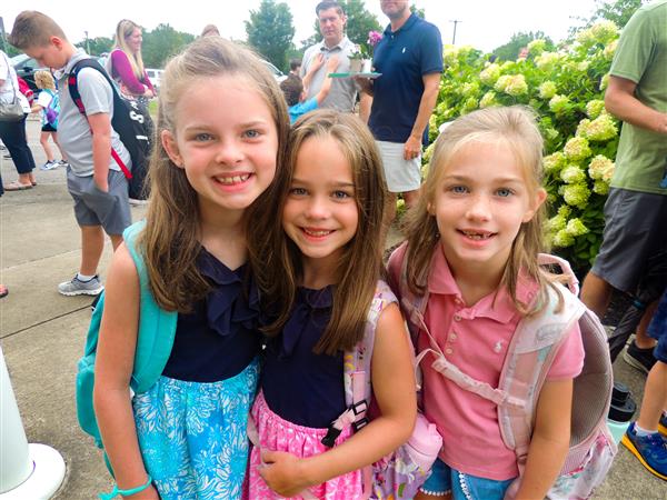three girls smiling